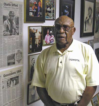 Charlie Sifford with memorabilia