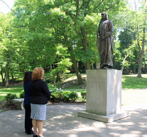 Ambassador Floreta Faber and Dona Brady gaze at Mother Teresa statue