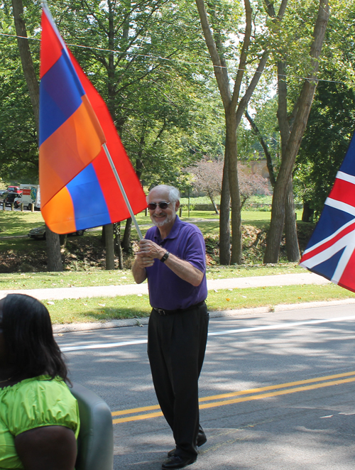 Berj Shakarian marching in the Parade of Nations with the Armenian Flag