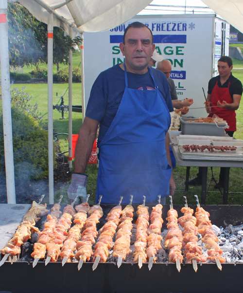 Parishioners grilling lamb and chicken