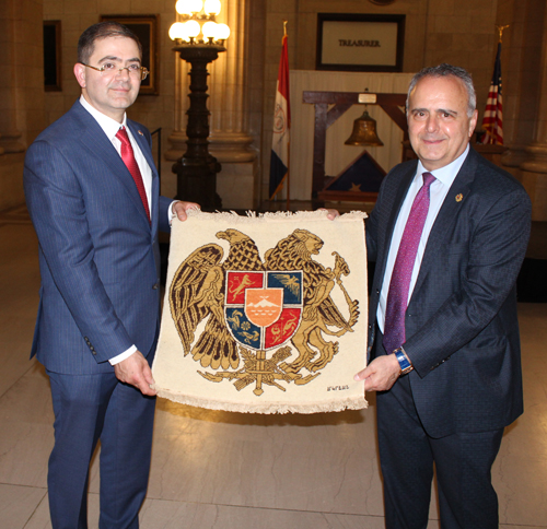 Honorary Armenian Consul Sergey Edilyan with artwork from  Oscar Tatosian Honorary Consol of Armenia in Chicago