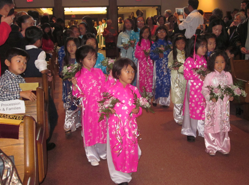Asian-American children in procession in Cleveland Mass
