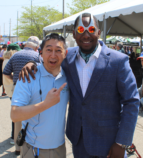 Councilman Basheer Jones tries on Johnny Wu's sunglasses