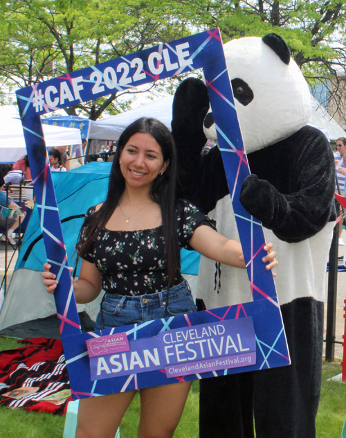 girl and panda mascot at CAF