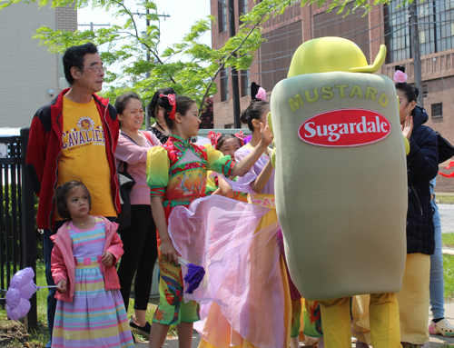 Posing with mascot at Cleveland Asian Festival