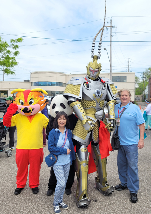 Dan Hanson and Oanh Loi-Powell Posing with mascot at Cleveland Asian Festival