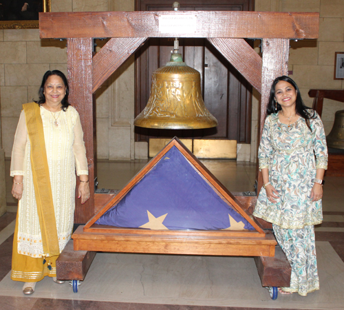 Posing with USS Cleveland Bell