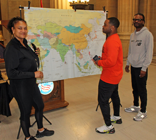 City people looking at map of Asia