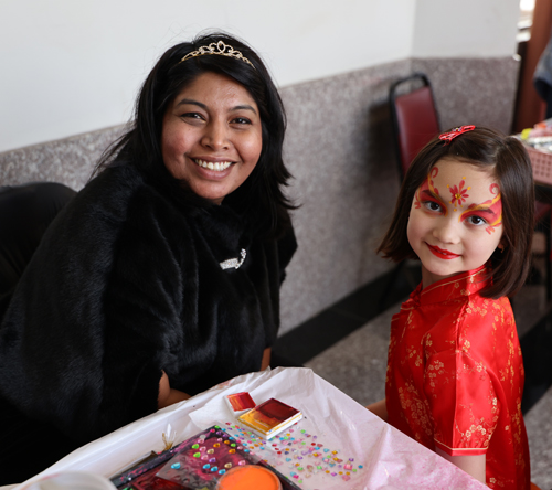 Parijata Jain painting a face