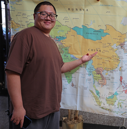 Pointing to map of China