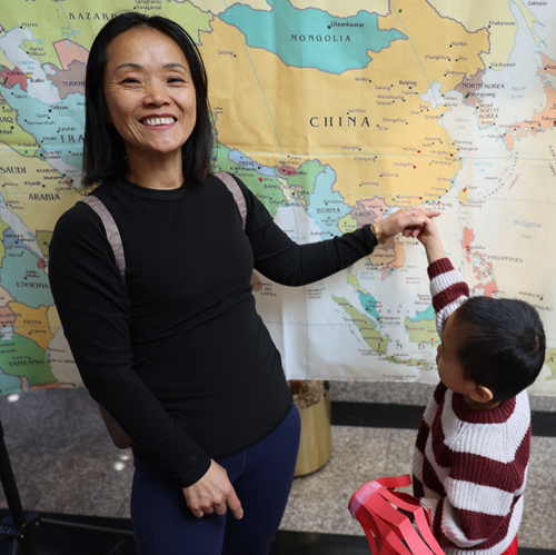 Pointing to map of Hong Kong