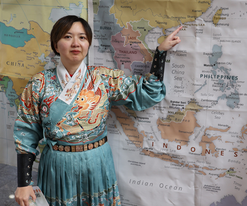 Pointing to map of Hong Kong