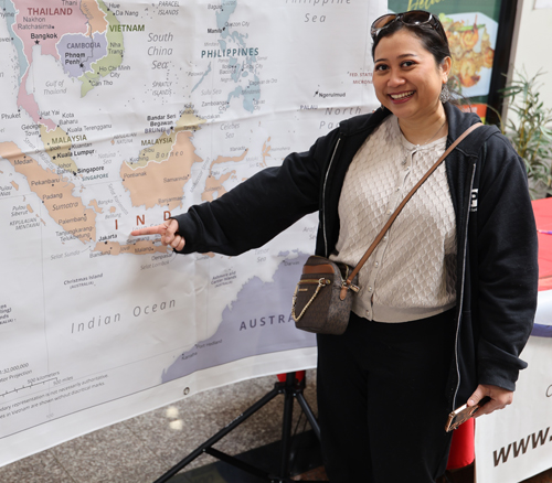 Pointing to map of Indonesia