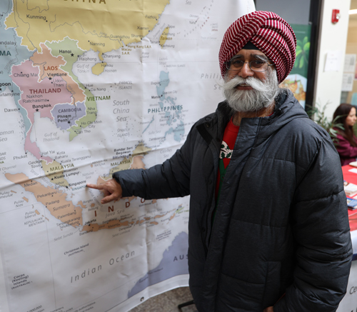 Pointing to map of Singapore