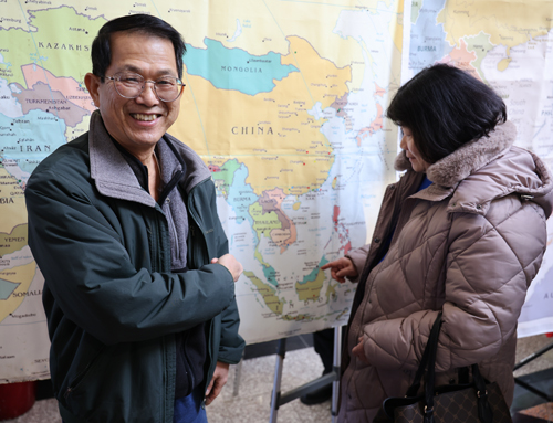 Pointing to map of China