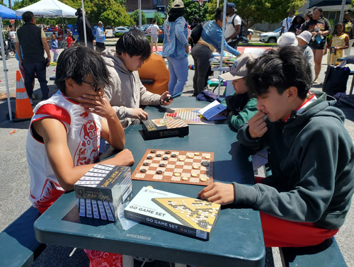 Playing chess at MidTown Cleveland's AsiaTown Children's Day
