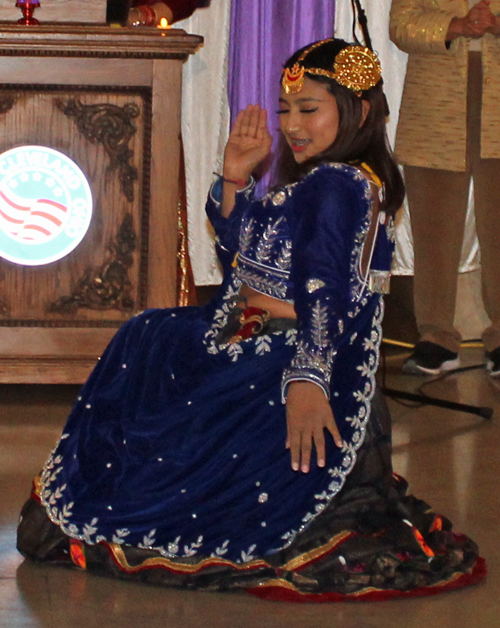 a young lady performing the Haseyra Bhola Bhainee Dance