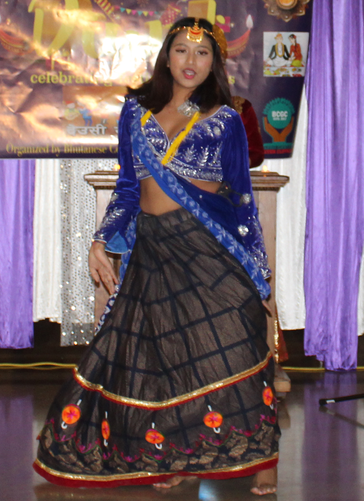 a young lady performing the Haseyra Bhola Bhainee Dance