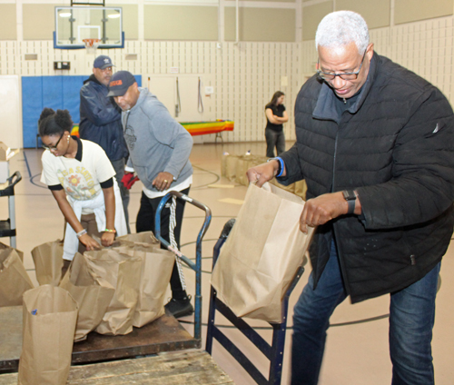 Brad Sellers and Greg Bell loading food