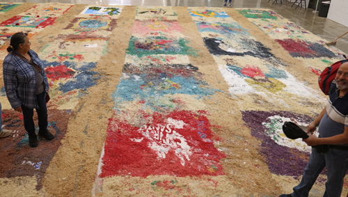 Sweeping the remanants of the Holy Week Carpets on Good Friday