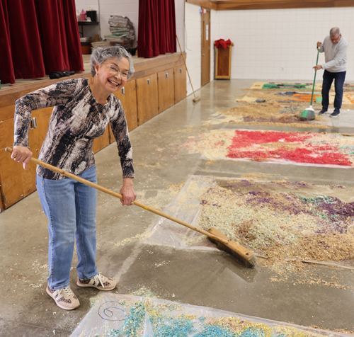 Sweeping the remanants of the Holy Week Carpets on Good Friday