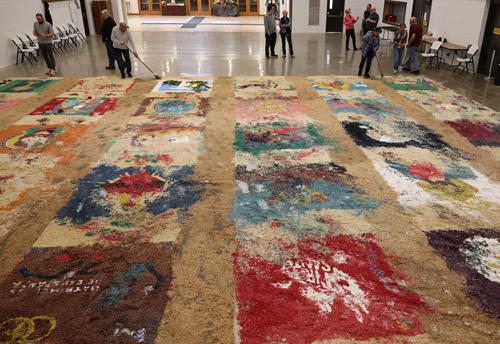 Sweeping the remanants of the Holy Week Carpets on Good Friday