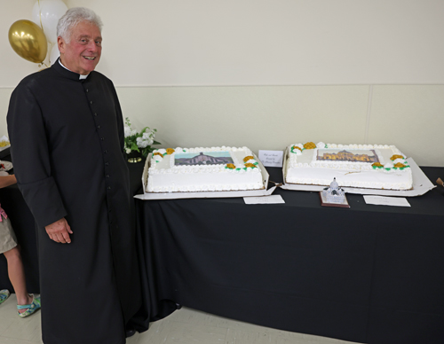 Father Phil Racco and cakes