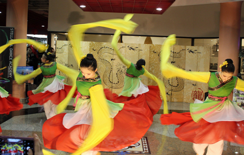 Teen girls perform a colorful Chinese Dance called Blossom of Proud Flowers 