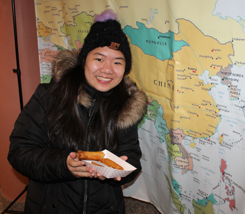 Eating eggrolls by the map of Asia
