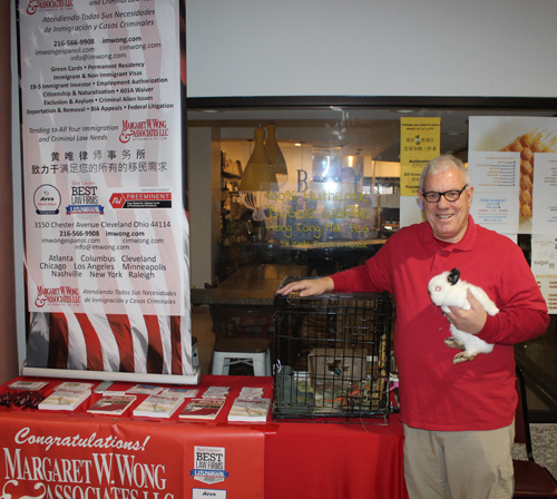 Michael Patterson in Margaret Wong booth with pet rabbit