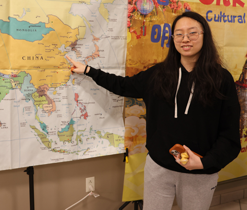 Girl pointing to map of China