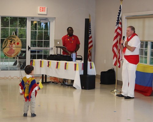 Singing the national anthems of Colombia and the United States