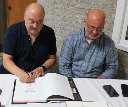 Frank Prpic and Tom Turkaly signing the book