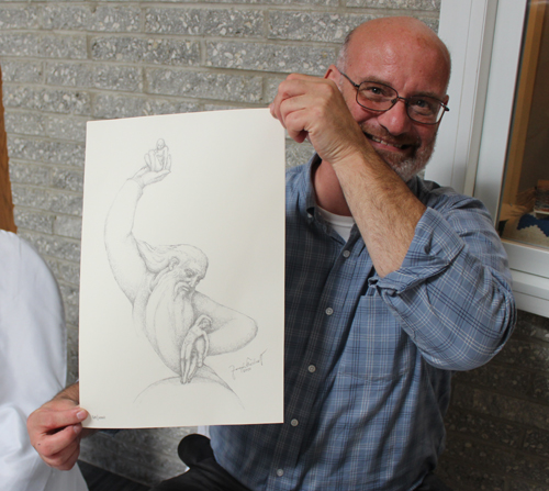 Tom Turkaly with a sketch of Creation
