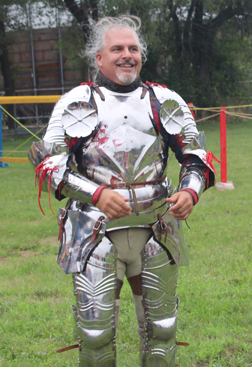 Knight putting on armor to prepare for joust - Sir Thomas