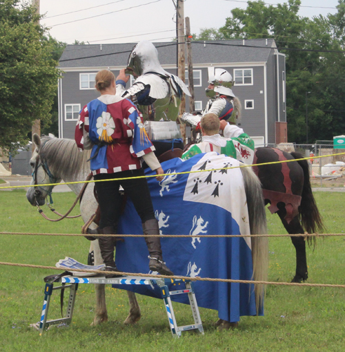 Putting the armor helmet on for the joust