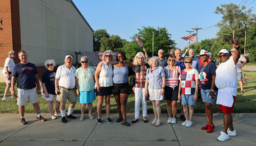 Group placing US flags at Czech Cultural Center