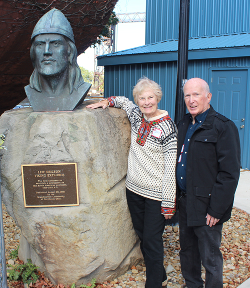 Cathy and Ron McCutcheon Posing with the bust of Leif Erikson on Leif Erikson Day in Cleveland 2025