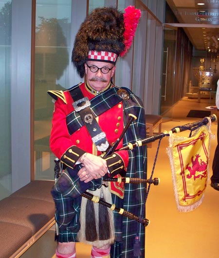 Bagpiper Don Willis represented the Scottish community