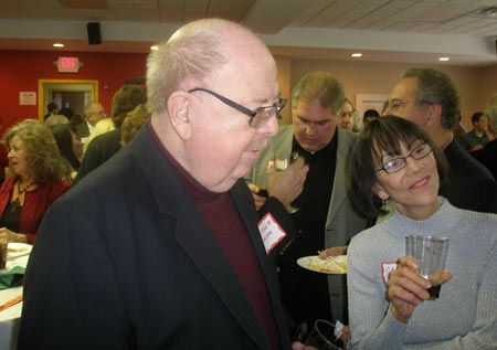 William F. Miller works the room at Margaret Wong's 2008 holiday party