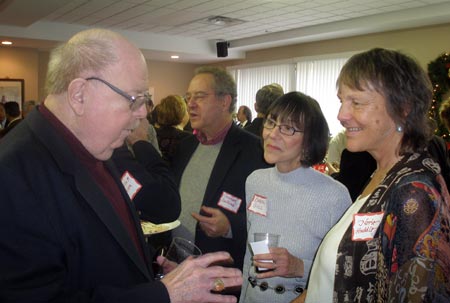 William F. Miller works the room at Margaret Wong's 2009 holiday party