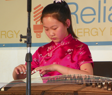 5th-grader Angela Wang plays the Guzheng, a traditional a Chinese plucked zither