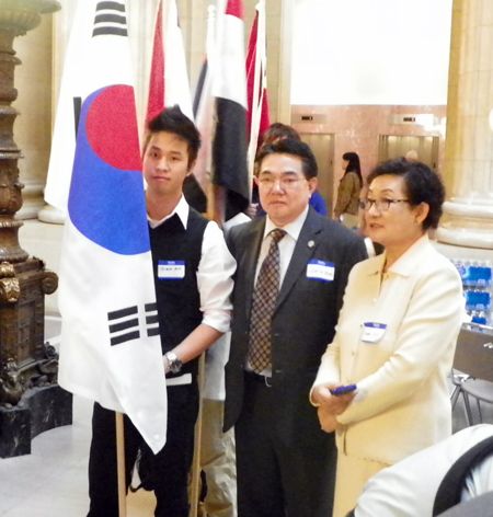 Sam Kim, Hanna Woo and flag bearer