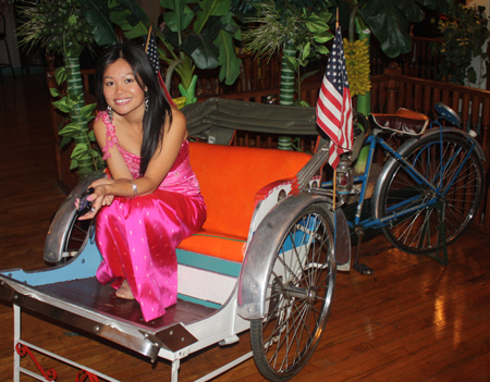 Girl in rickshaw at Saigon Plaza