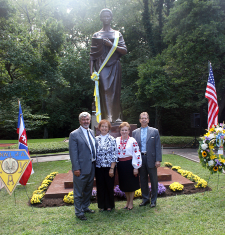Paul and Fran Burik and Chris and Dick Russ in front of the Lesya Ukrainka statue