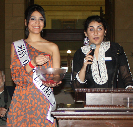 Miss Ohio Latina Yasin Cuevas helps Arooj Ashraf with the raffle