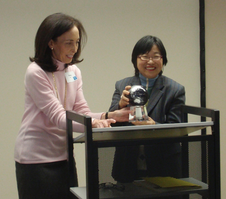 Shelley Roth gives Margaret W. Wong an award