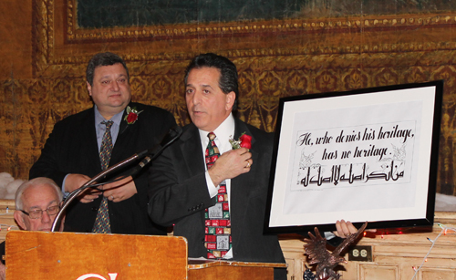 Pierre Bejjani and Mark George with sign with quote from Kahlil Gibran