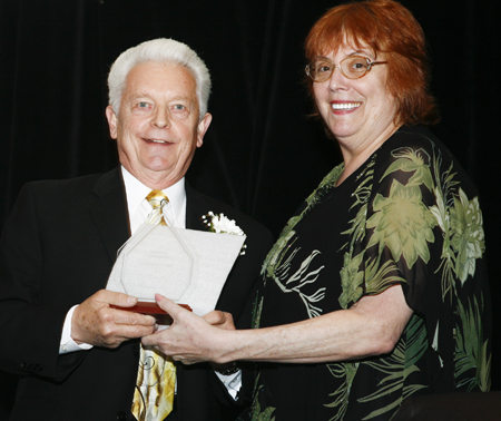 Ken Kovach and Debbie Hanson with award