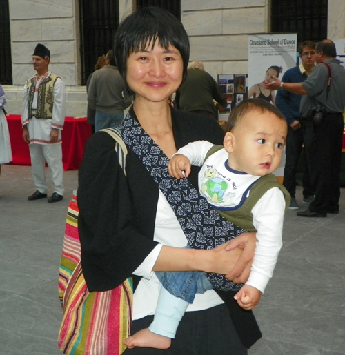 Wenji Zhang and son Aten People watching at Atrium opening at Cleveland Museum of Art